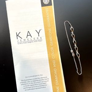 Kays, gold, silver and small diamond adjustable bracelet.